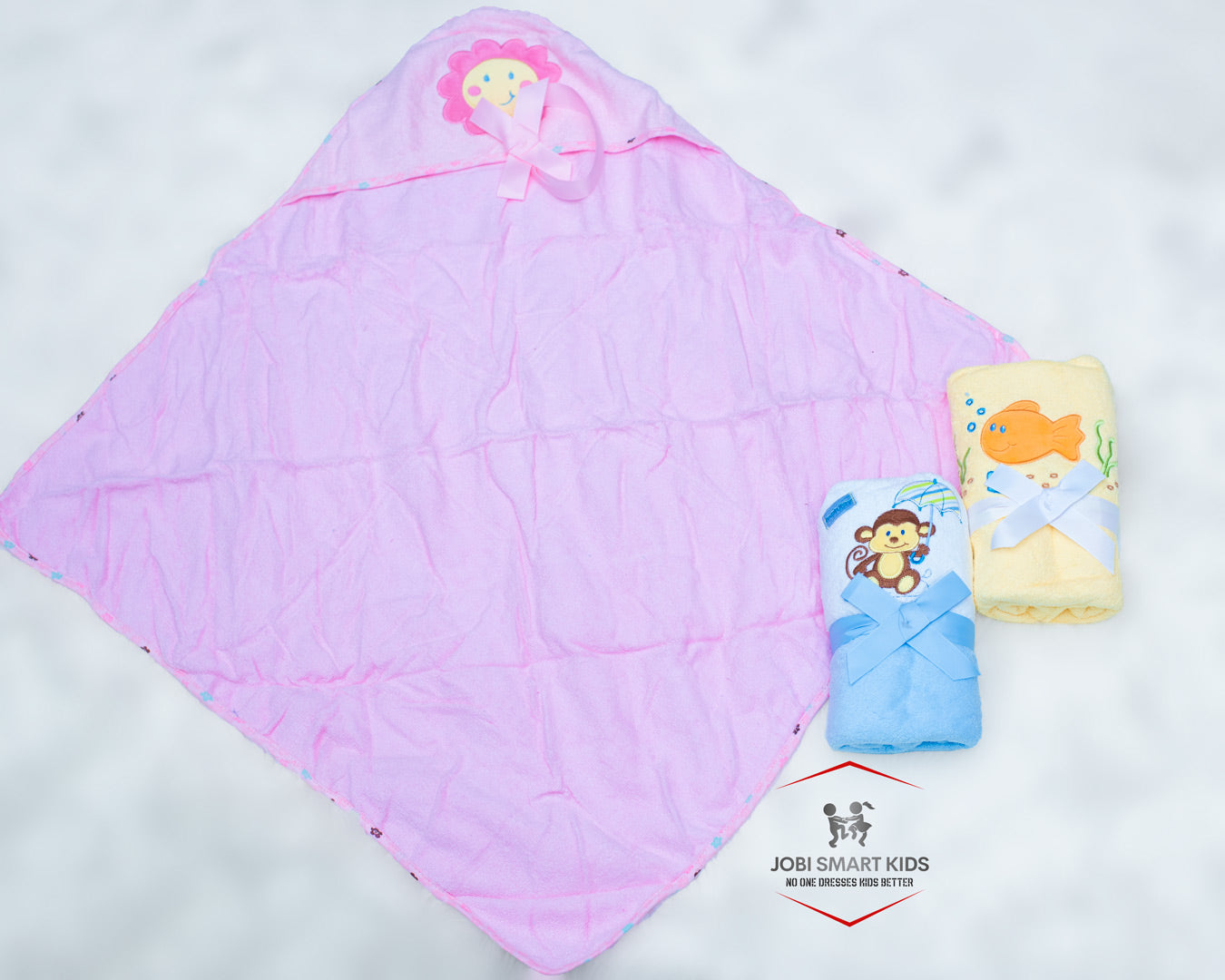 pink, yellow and blue baby hooded towels